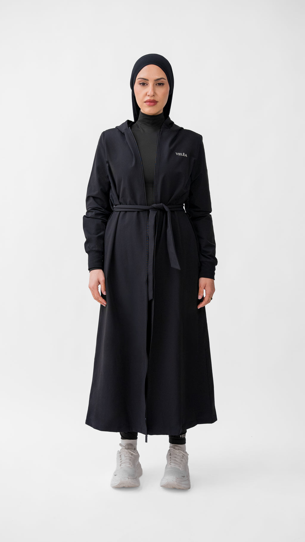 VELÉA Céleste Cloak — oversized hooded modest activewear layer in matte black