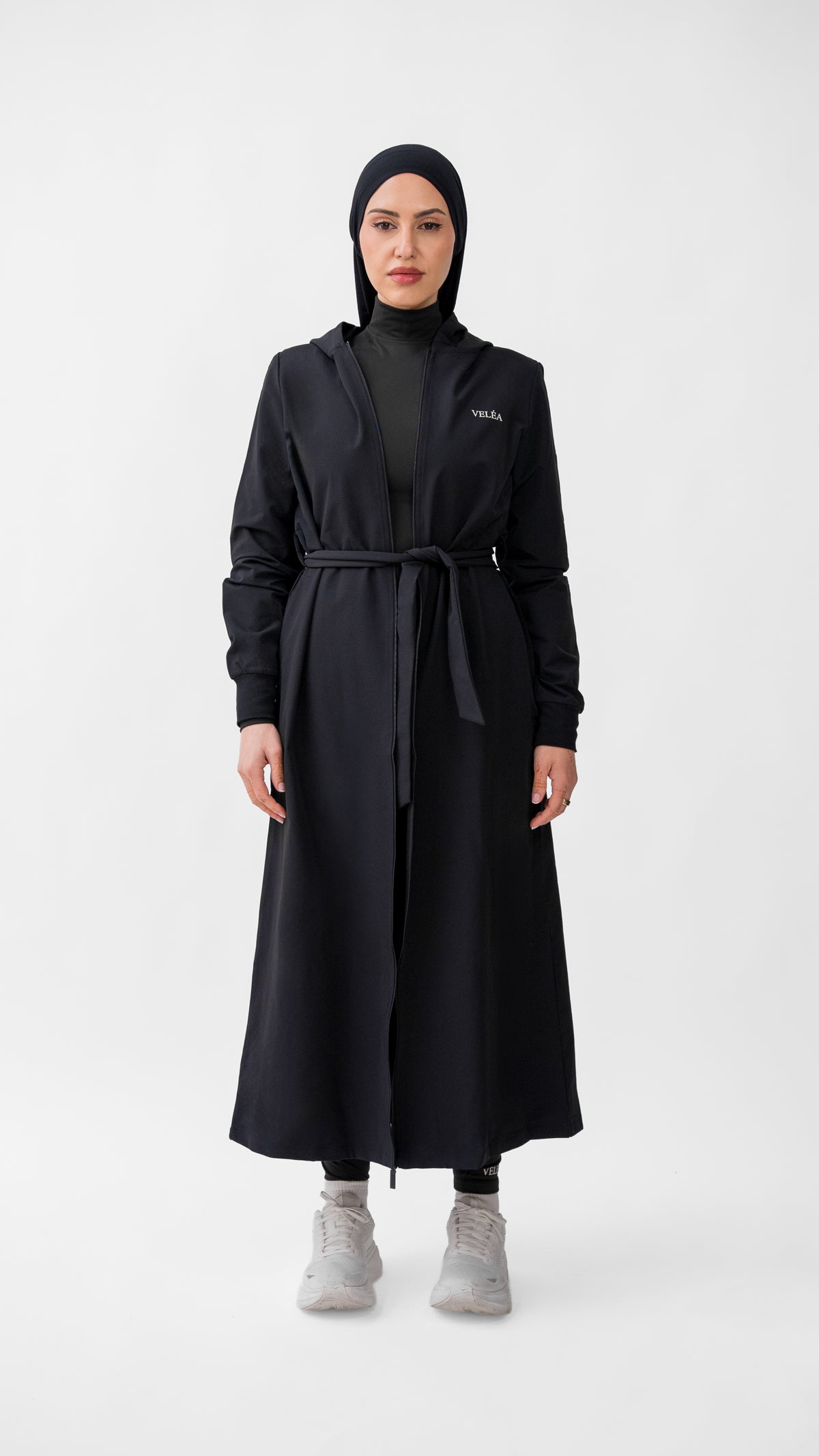 VELÉA Céleste Cloak — oversized hooded modest activewear layer in matte black